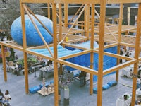a wooden structure with a blue ball in it